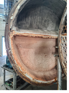 An interior image of a boiler, showing the refractory.